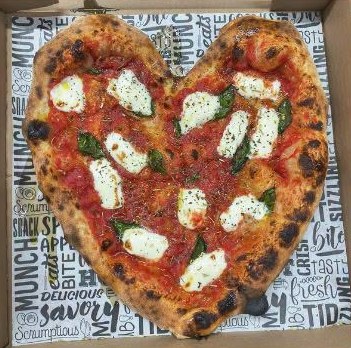 Heart-shaped Margherita pizza in a Basil box